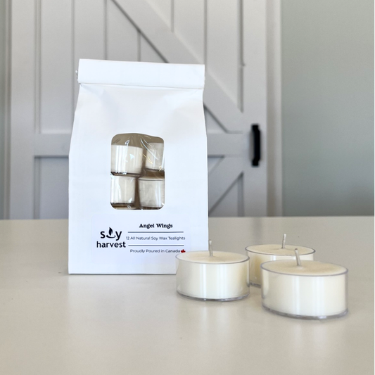 Soy Harvest tea light candles with packaging on a neutral background