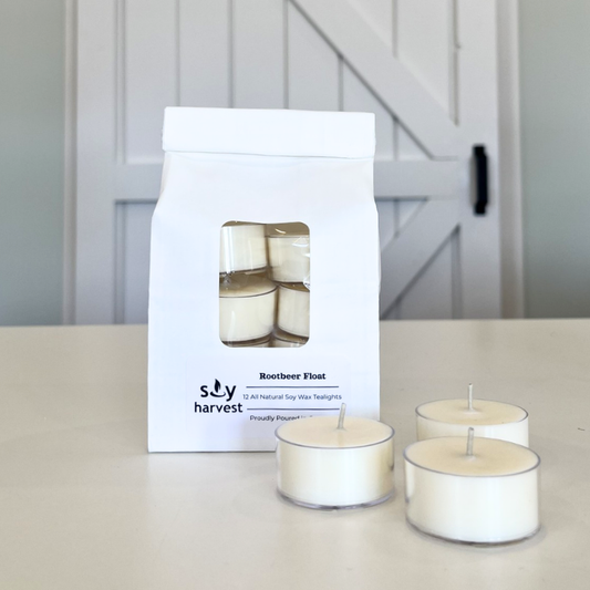 Soy Harvest rootbeer float tealights in packaging on a table, white wax, cotton wick